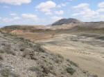 Cretaceous shales, Sheep Mt. on skyline.